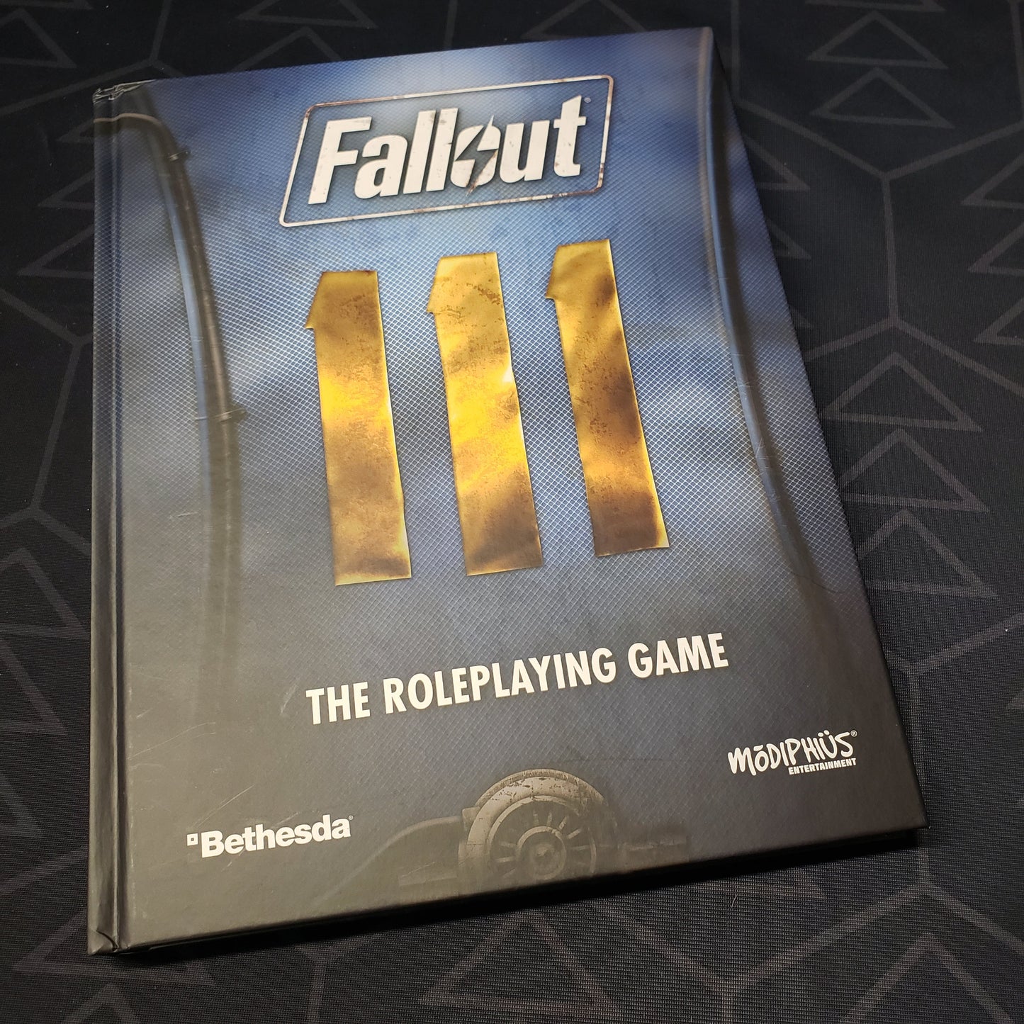 Image shows the front cover of the core rulebook for the Fallout roleplaying game