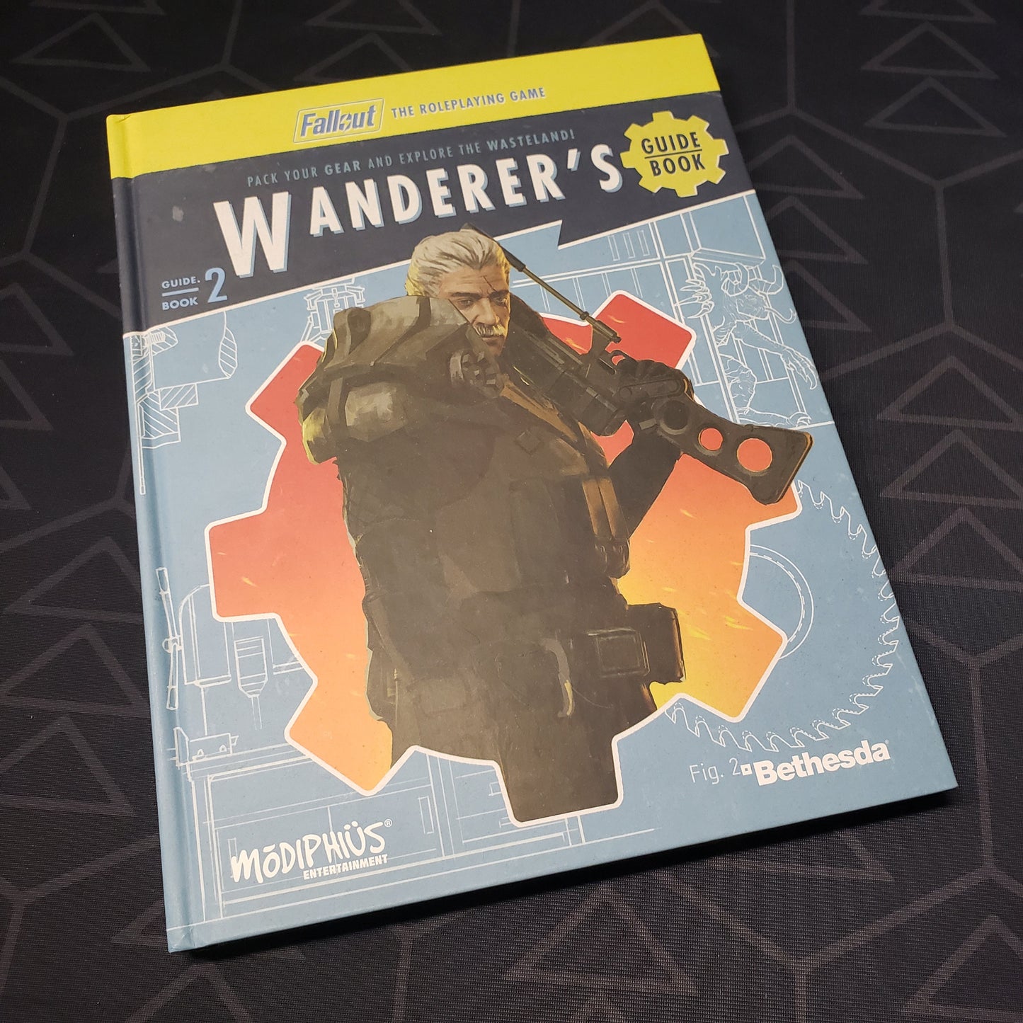 Image shows the front cover of the Wanderer's Guide Book for the roleplaying game Fallout