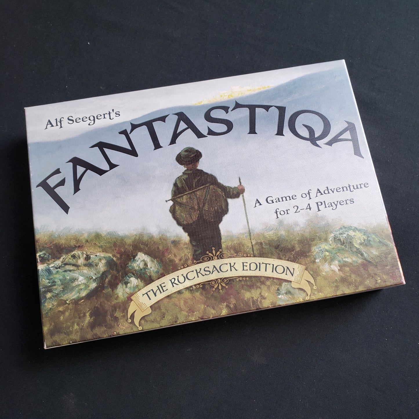 Image shows the front cover of the box of the Fantastiqa board game