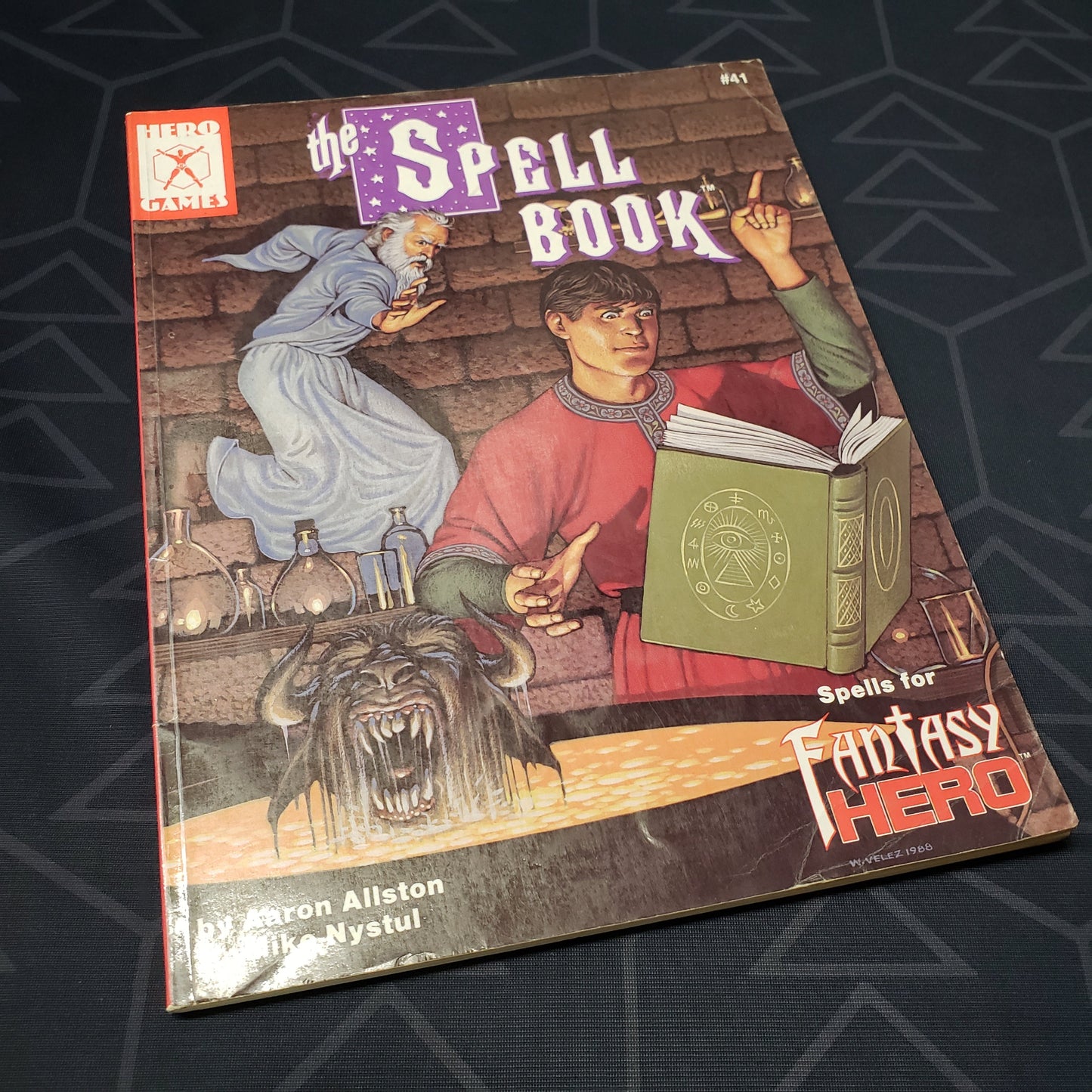 Image shows the front cover of The Spell Book for the roleplaying game Fantasy Hero