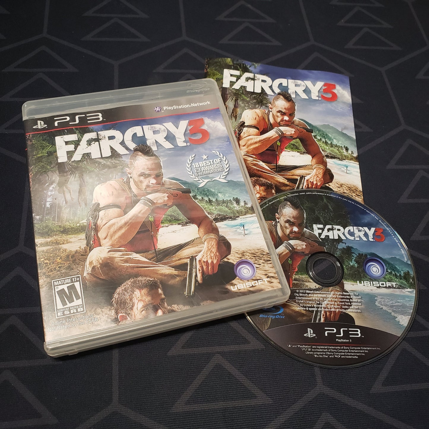 Image shows the case, manual and disc for the video game Far Cry 3 for Playstation 3
