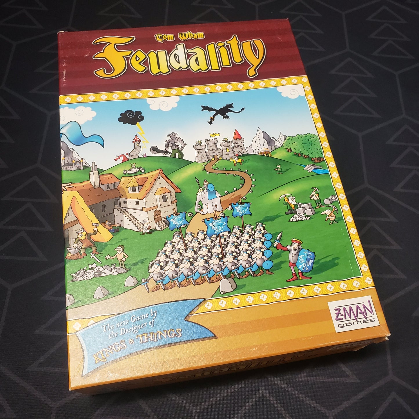 Image shows the front cover of the box for the Feudality board game
