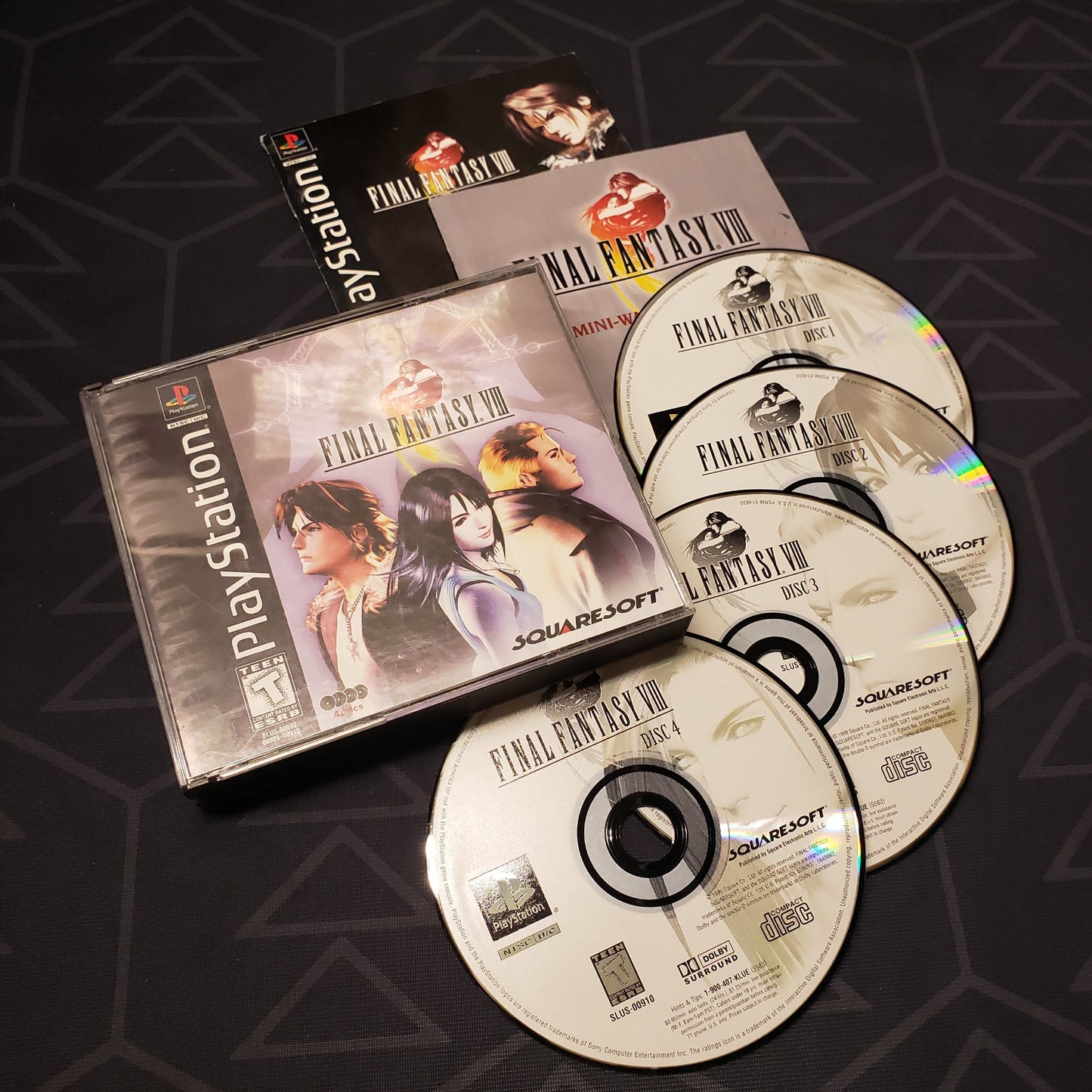 Image shows the jewel case, two manuals and four discs for the video game Final Fantasy VIII for Playstation 1