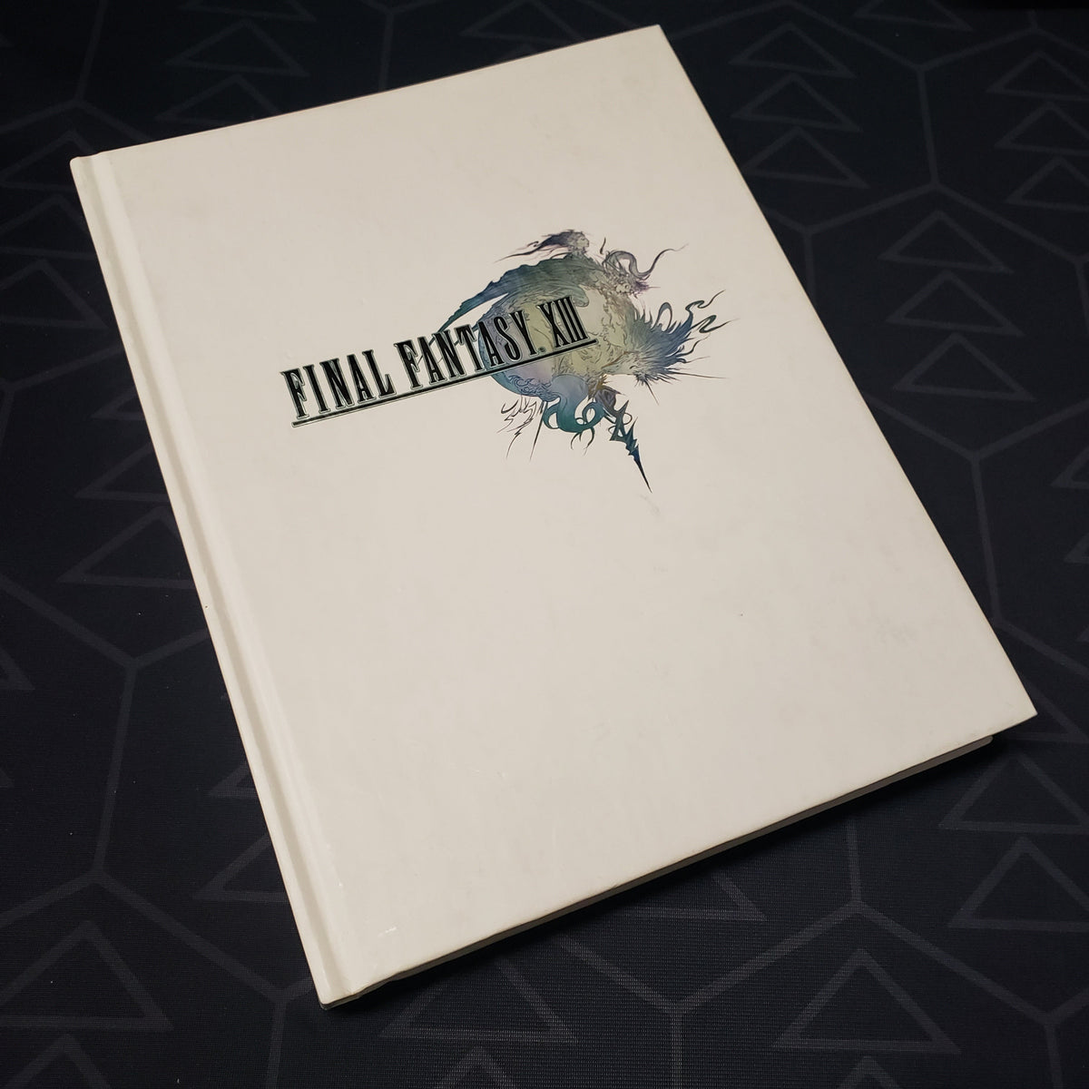 Image shows the front cover of the Final Fantasy XIII: The Complete Official Strategy Guide book