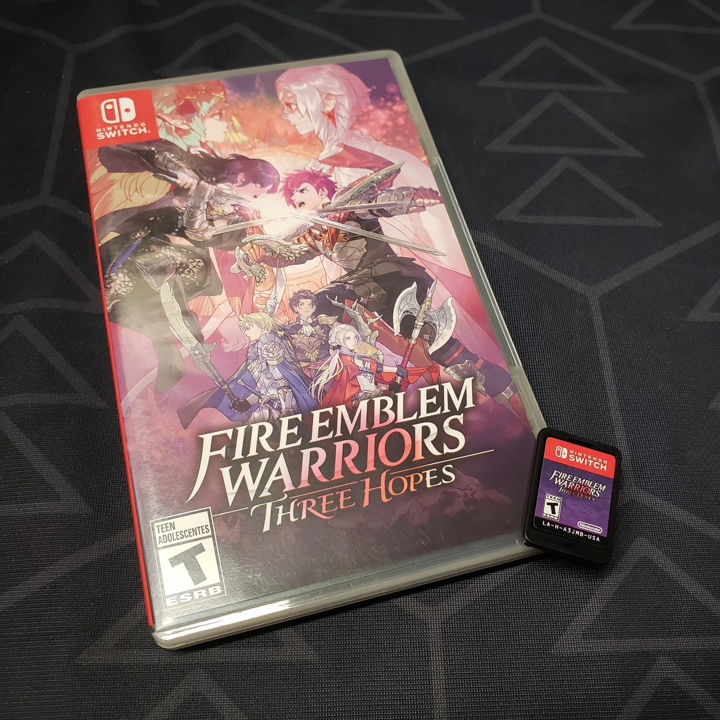Image shows the case & cartridge for the video game Fire Emblem Warriors: Three Hopes for Nintendo Switch