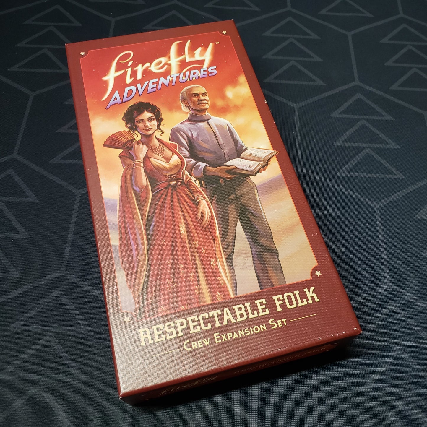 Image shows the front cover of the box of the Respectable Folk expansion for the board game Firefly Adventures