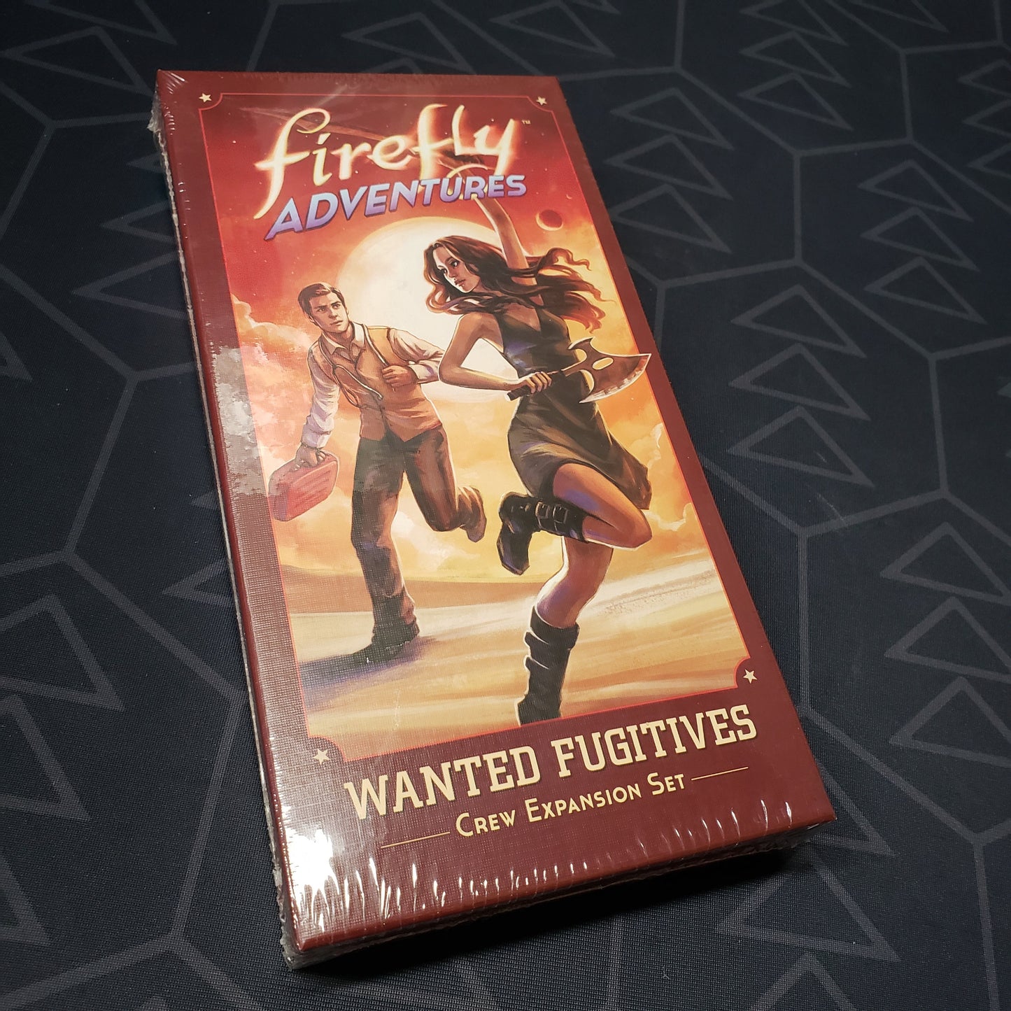 Image shows the front cover of the box of the Wanted Fugitives expansion for the board game Firefly Adventures