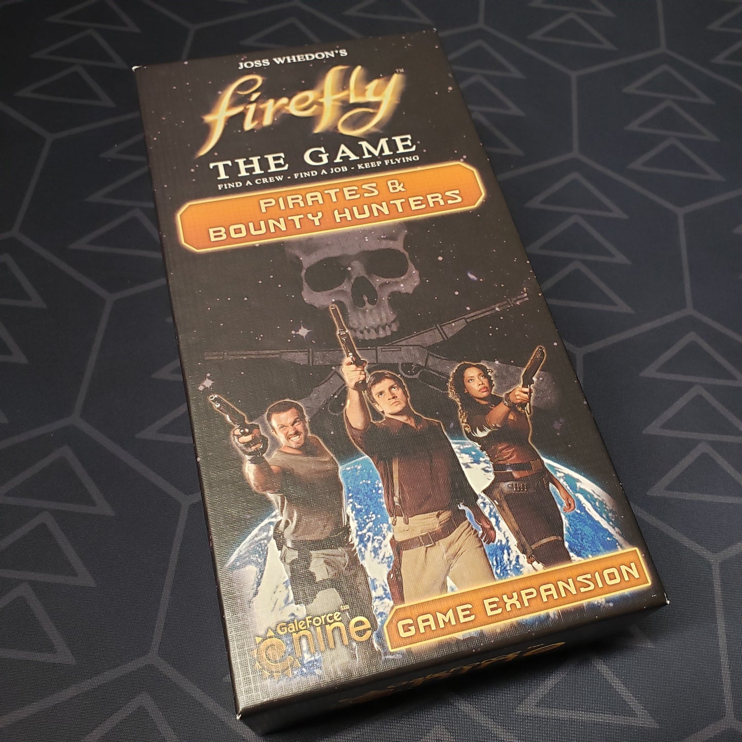 Image shows the front cover of the box of the Pirates & Bounty Hunters expansion for the Firefly board game