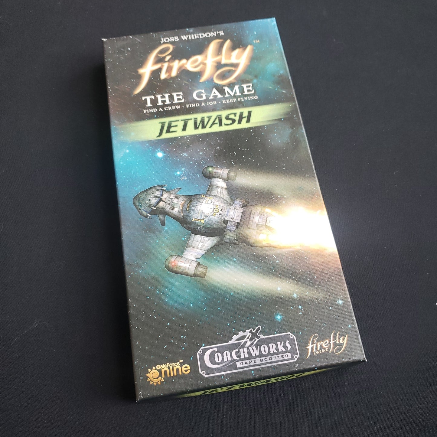 Image shows the front cover of the box of the Jetwash expansion for the board game Firefly: The Game