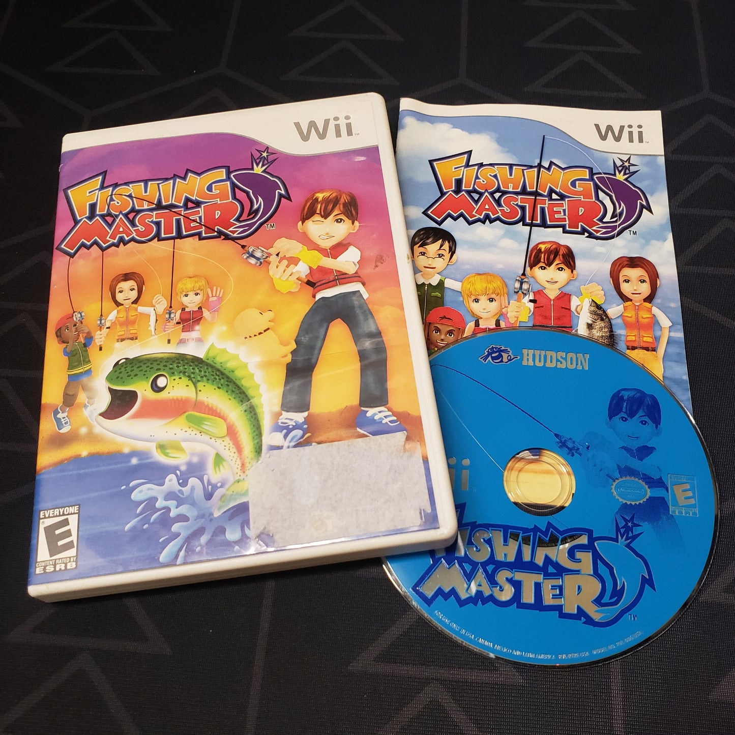 Image shows the case, manual & disc for the video game Fishing Master for Nintendo Wii