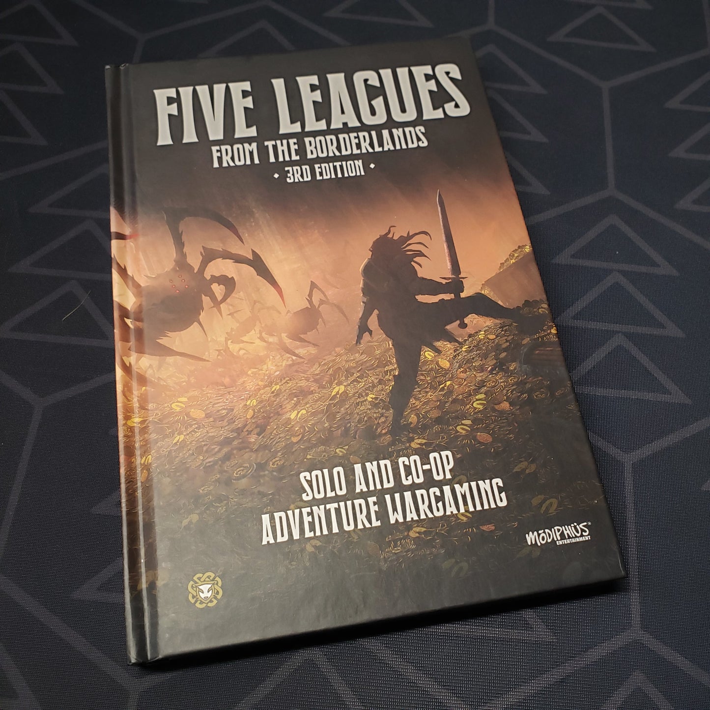 Image shows the front cover of the Five Leagues from the Borderlands gaming book