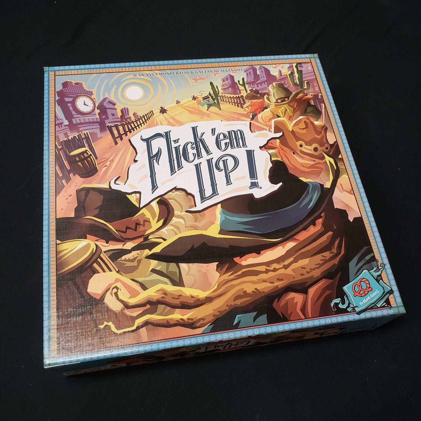 Image shows the front cover of the box of the Flick 'Em Up board game