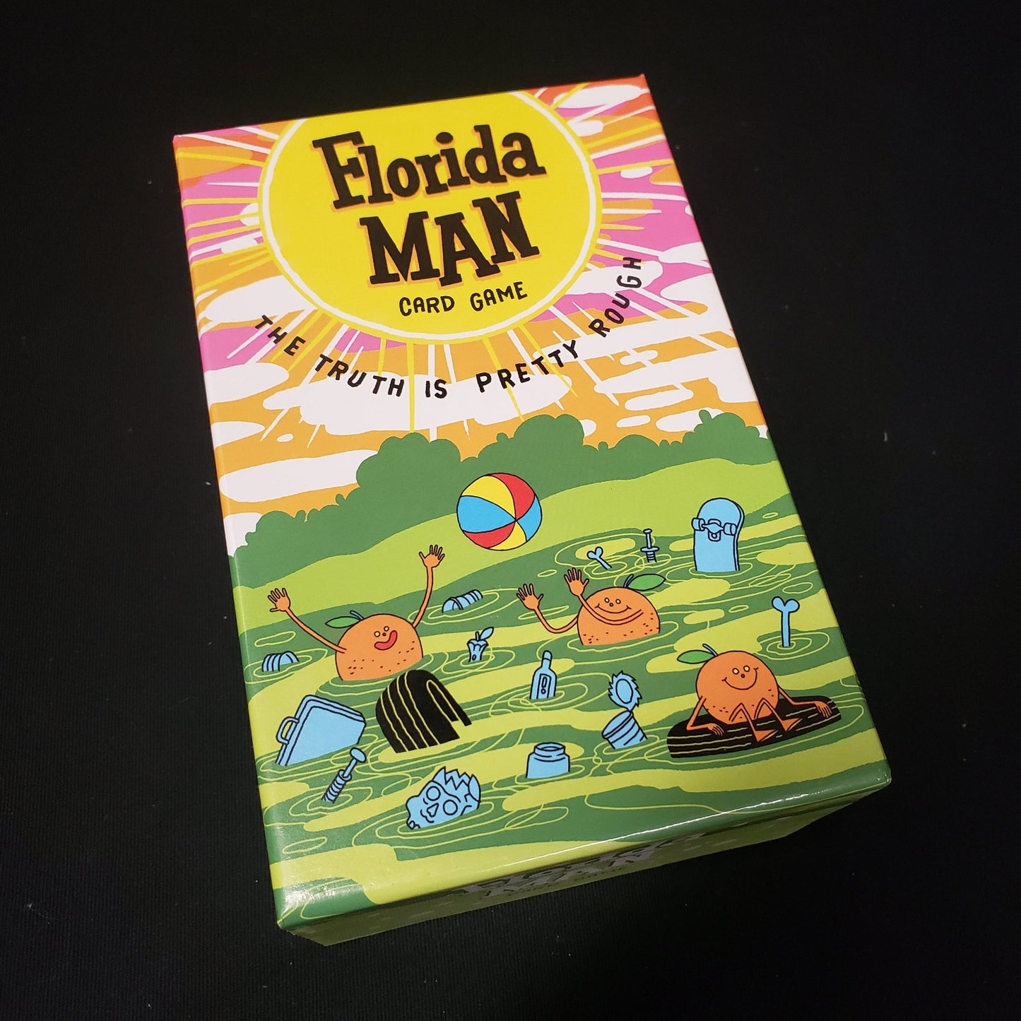 Image shows the front cover of the box of the Florida Man card game