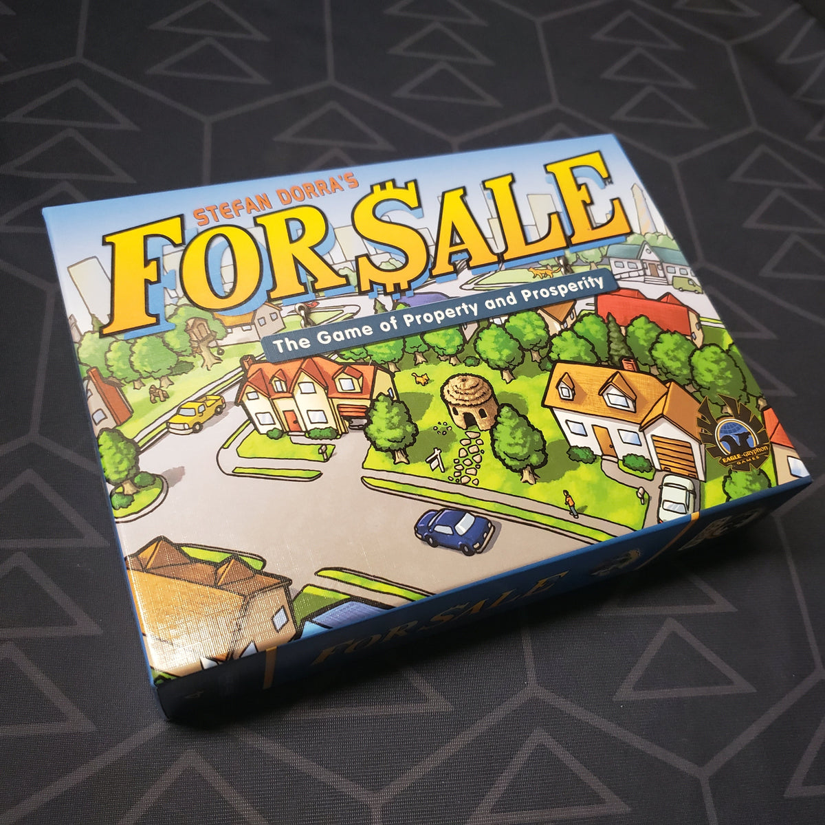 Image shows the front cover of the box for the For Sale card game