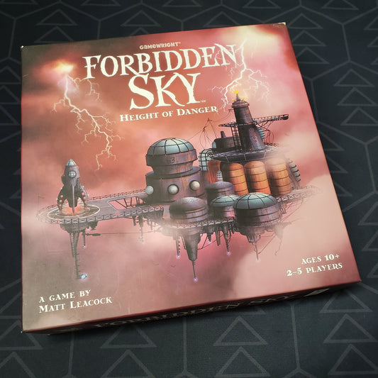 Image shows the front cover of the box of the Forbidden Sky board game