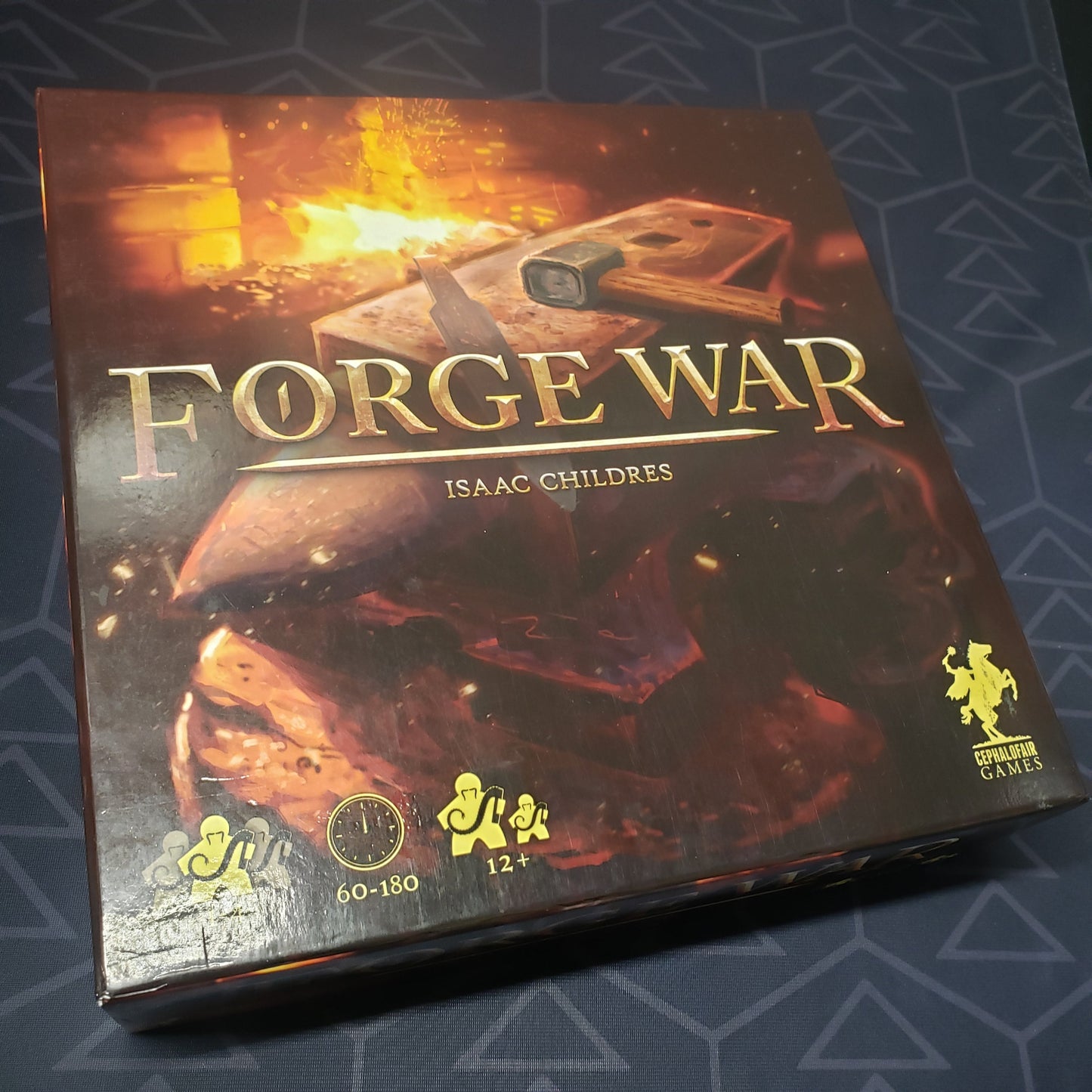 Image shows the front cover of the box of the Forge War board game