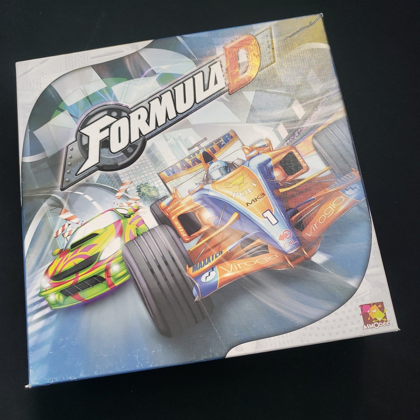 Image shows the front cover of the box of the Formula D board game