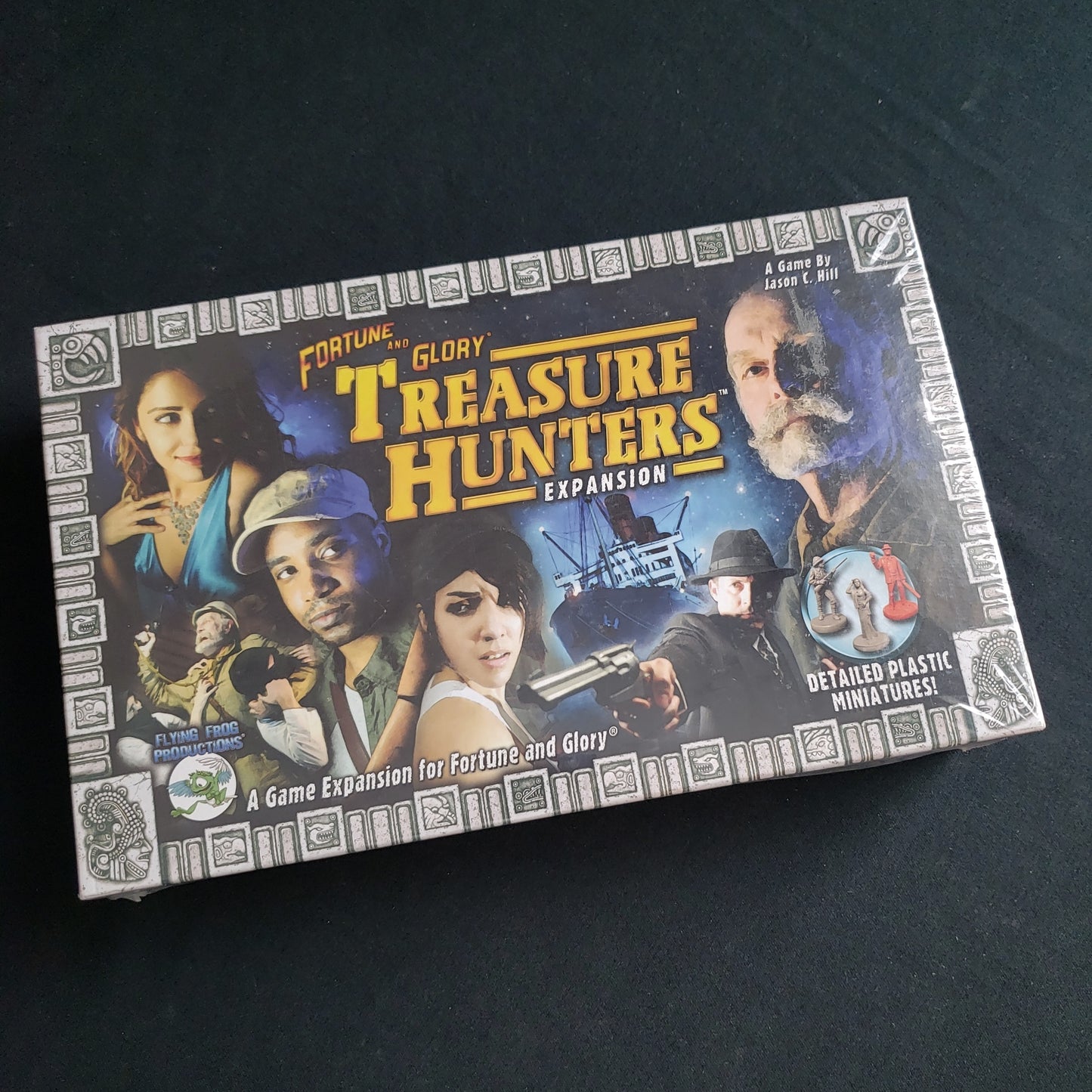 Image shows the front cover of the box of the Treasure Hunters expansion for the board game Fortune & Glory