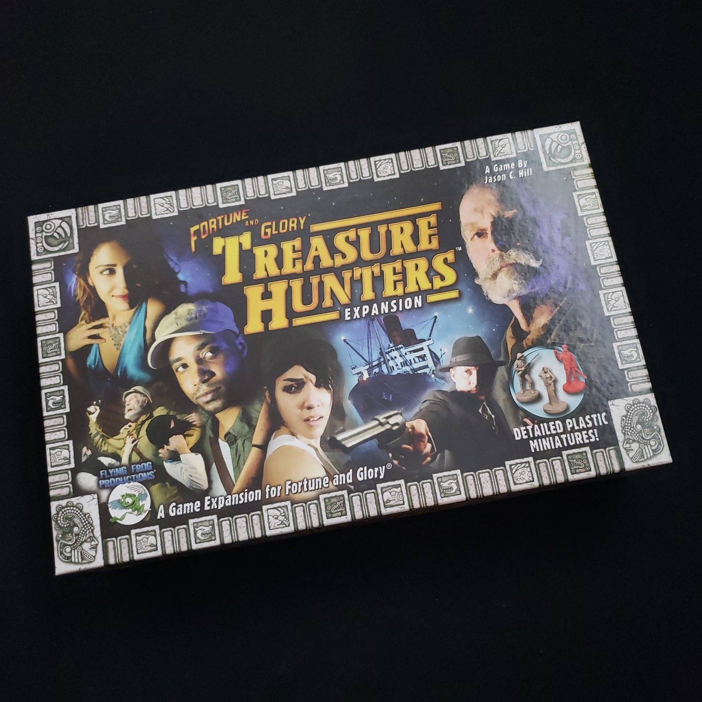 Image shows the front cover of the box of the Treasure Hunters expansion for the board game Fortune & Glory