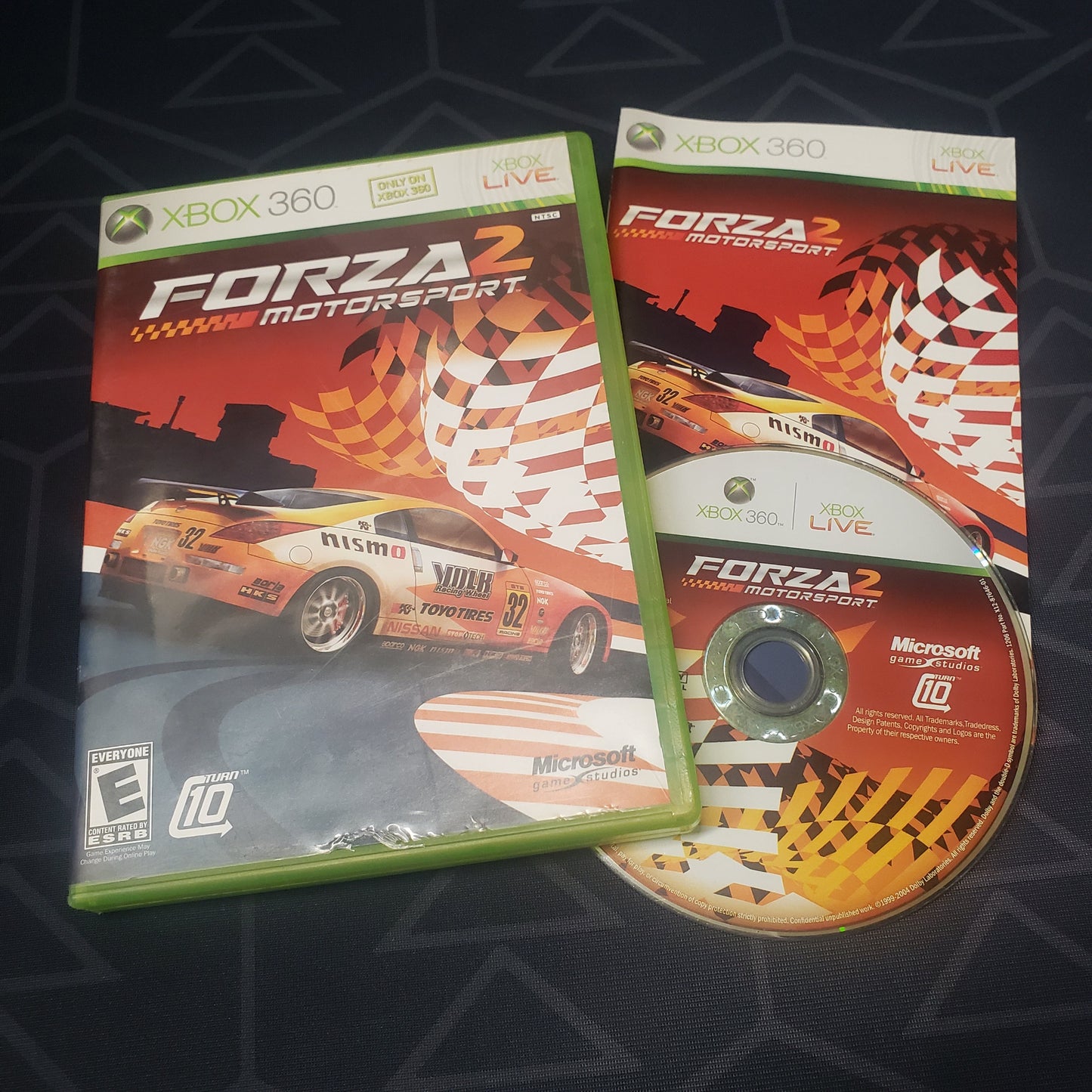 Image shows the case, manual & disc for the video game Forza Motorsport 2 for Xbox 360