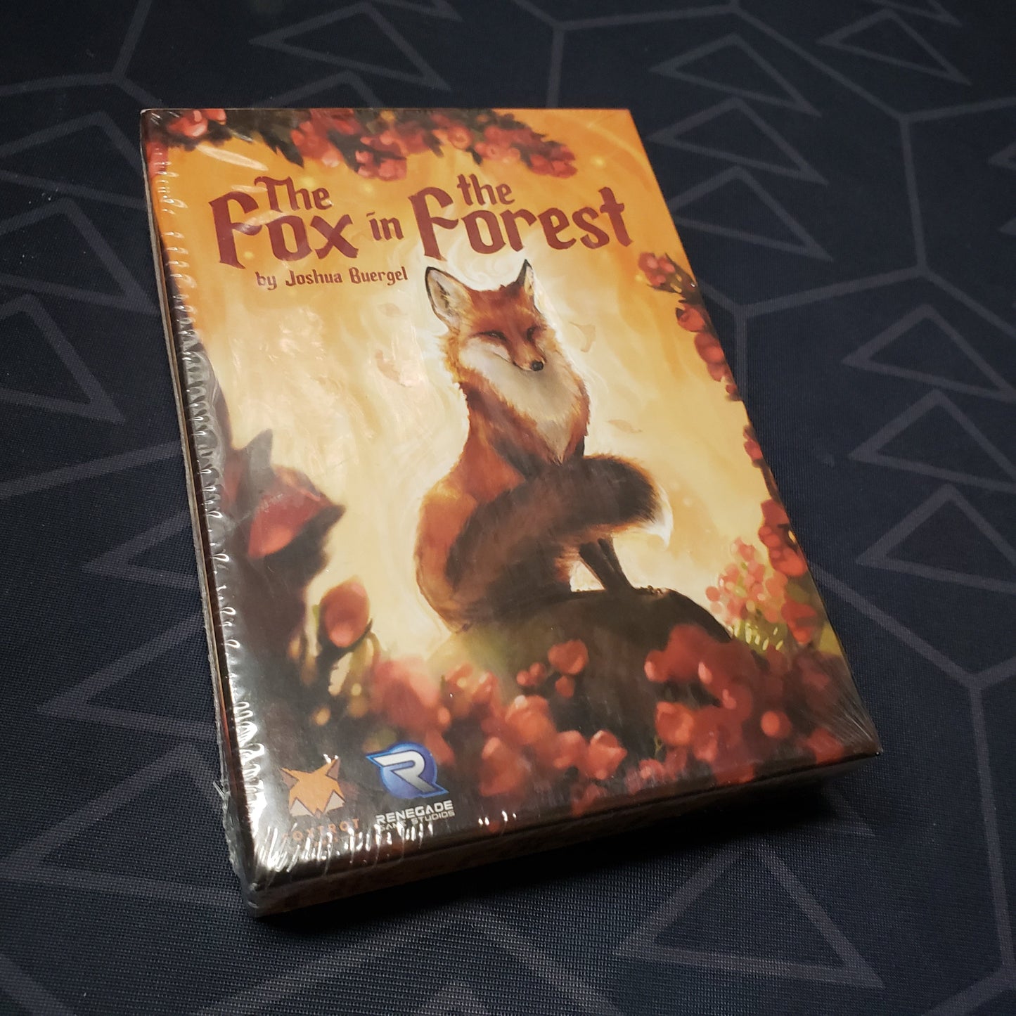 Image shows the front cover of the box of the card game The Fox in the Forest