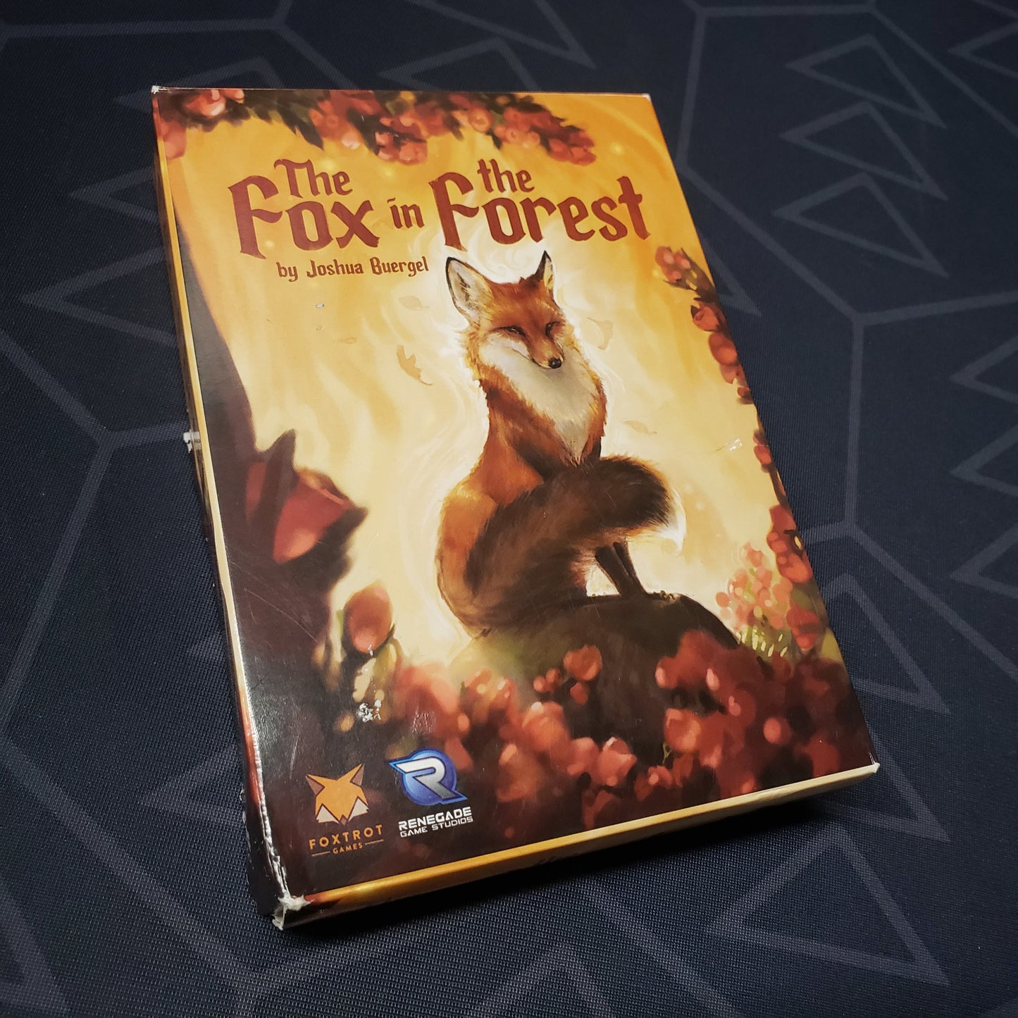 Image shows the front cover of the box of the card game The Fox in the Forest