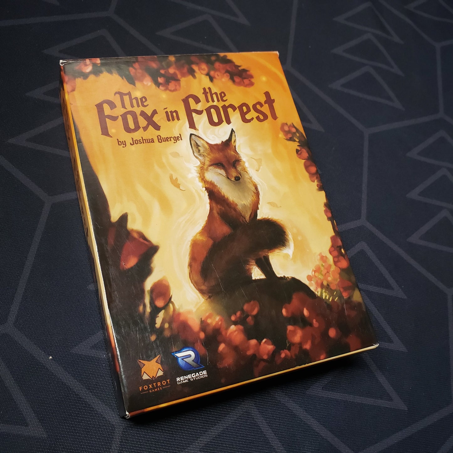 Image shows the front cover of the box of the card game The Fox in the Forest