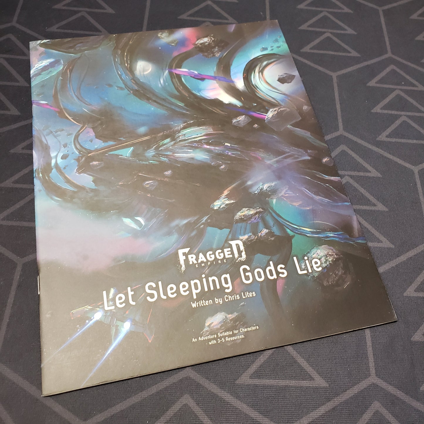 Image shows the front cover of the Let Sleeping Gods Lie book for the roleplaying game Fragged Empire