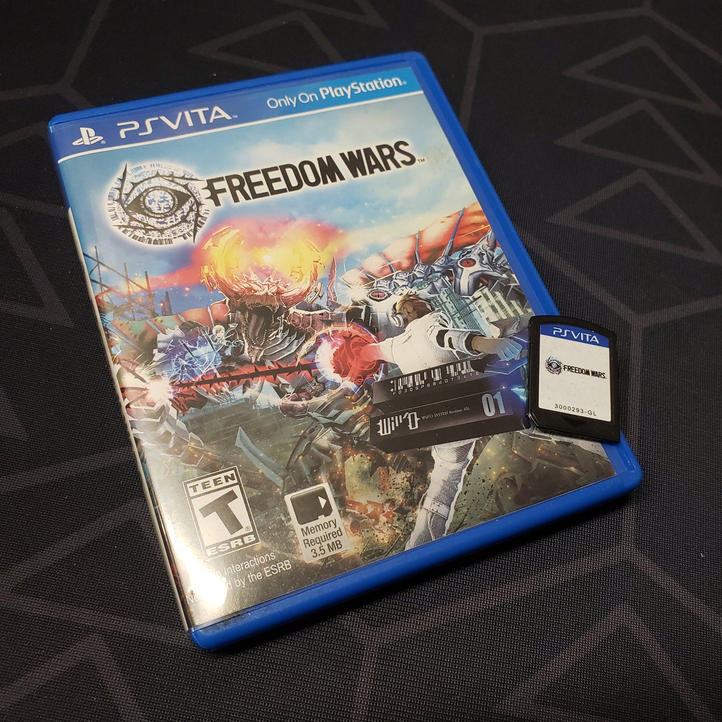 Image shows the case and cartridge for the video game Freedom Wars for Playstation Vita