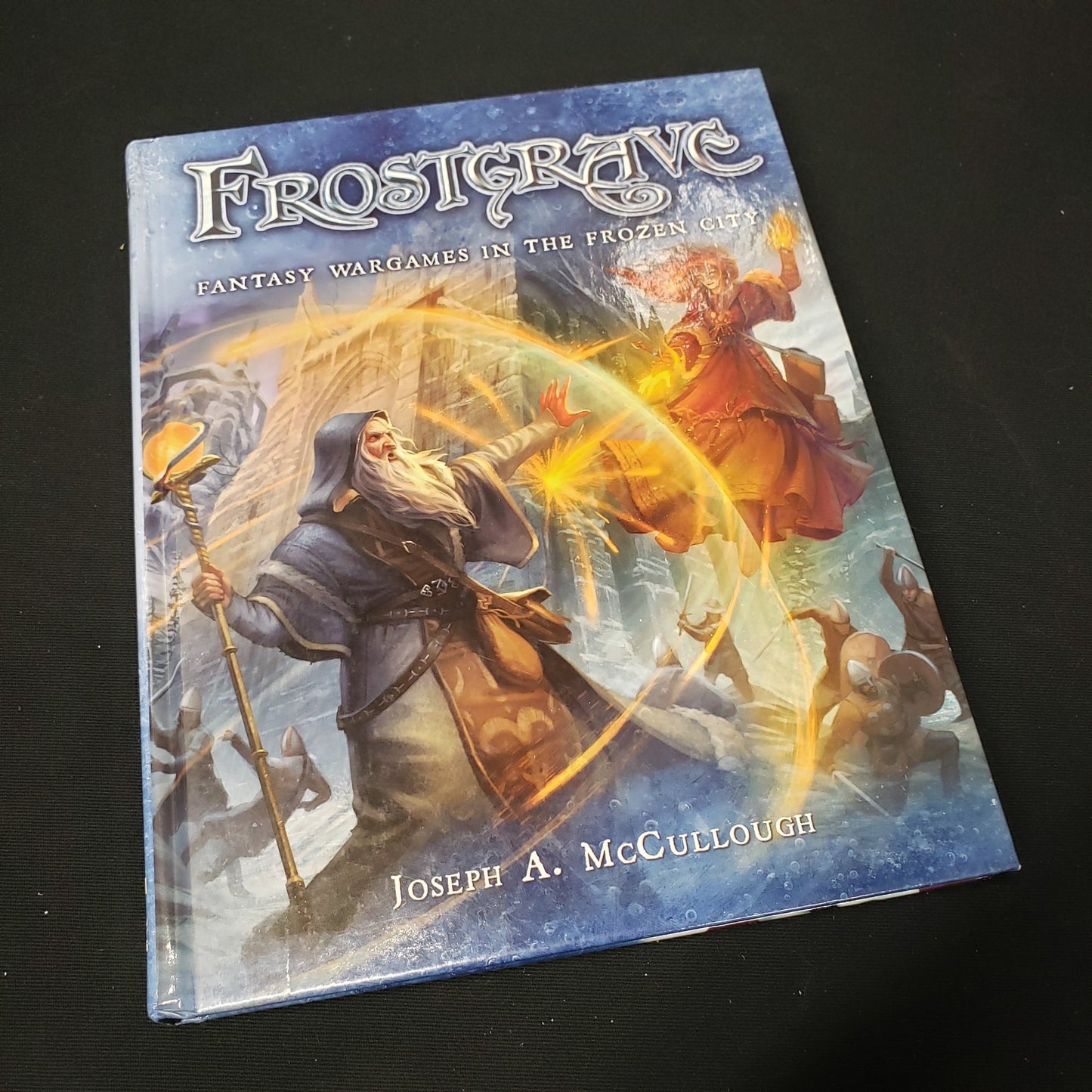 Image shows the front cover of the Frostgrave war game book