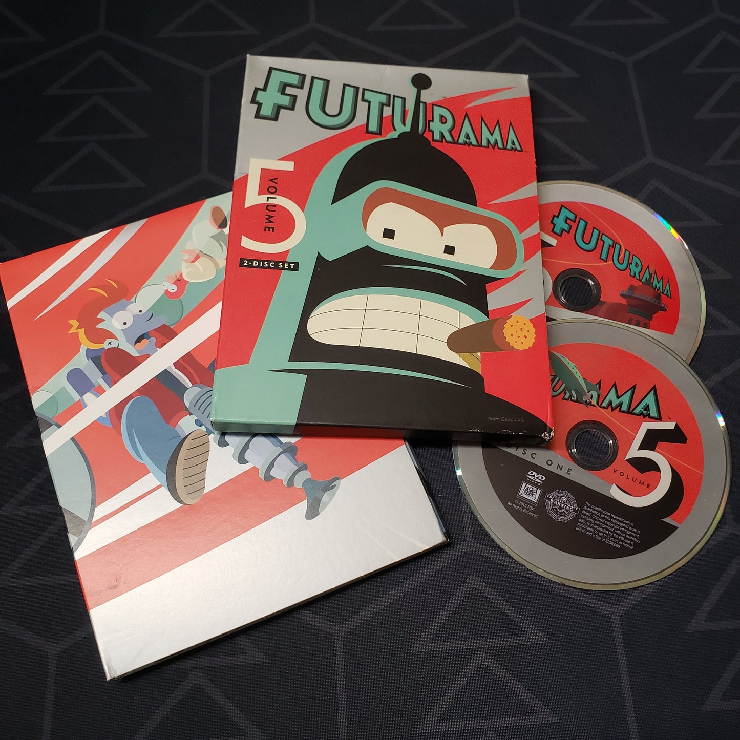 Image shows the case, outer box & two discs for the Volume 5 set of the TV series Futurama on DVD