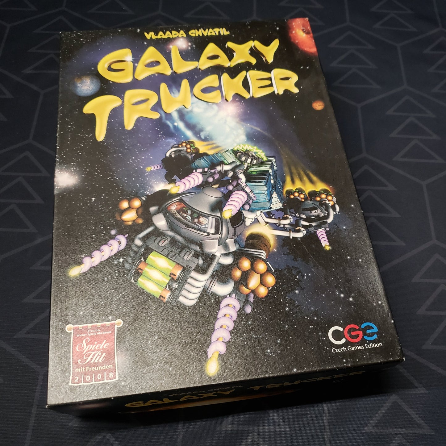 Image shows the front cover of the box of the Galaxy Trucker board game