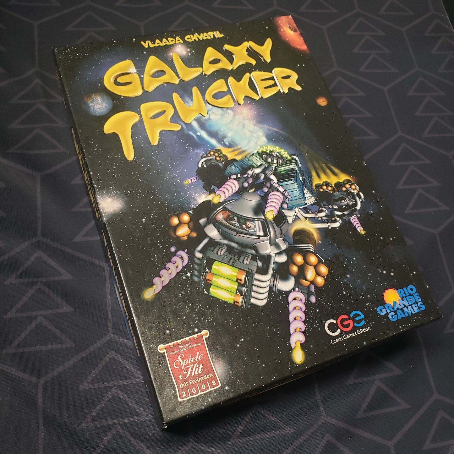 Image shows the front cover of the box of the Galaxy Trucker board game