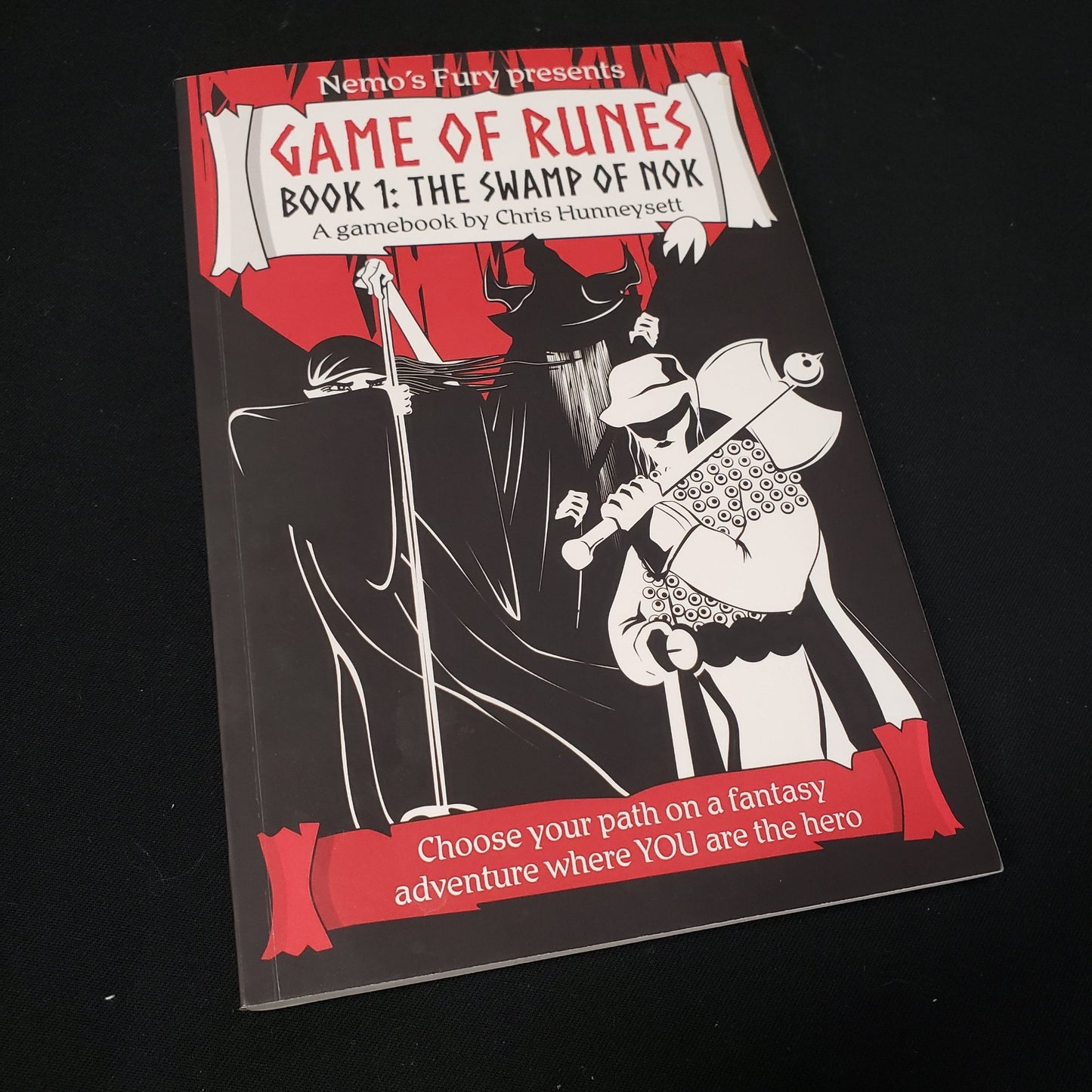 Image shows the front cover of the Game of Runes - Book 1: The Swamp of Nok roleplaying game book