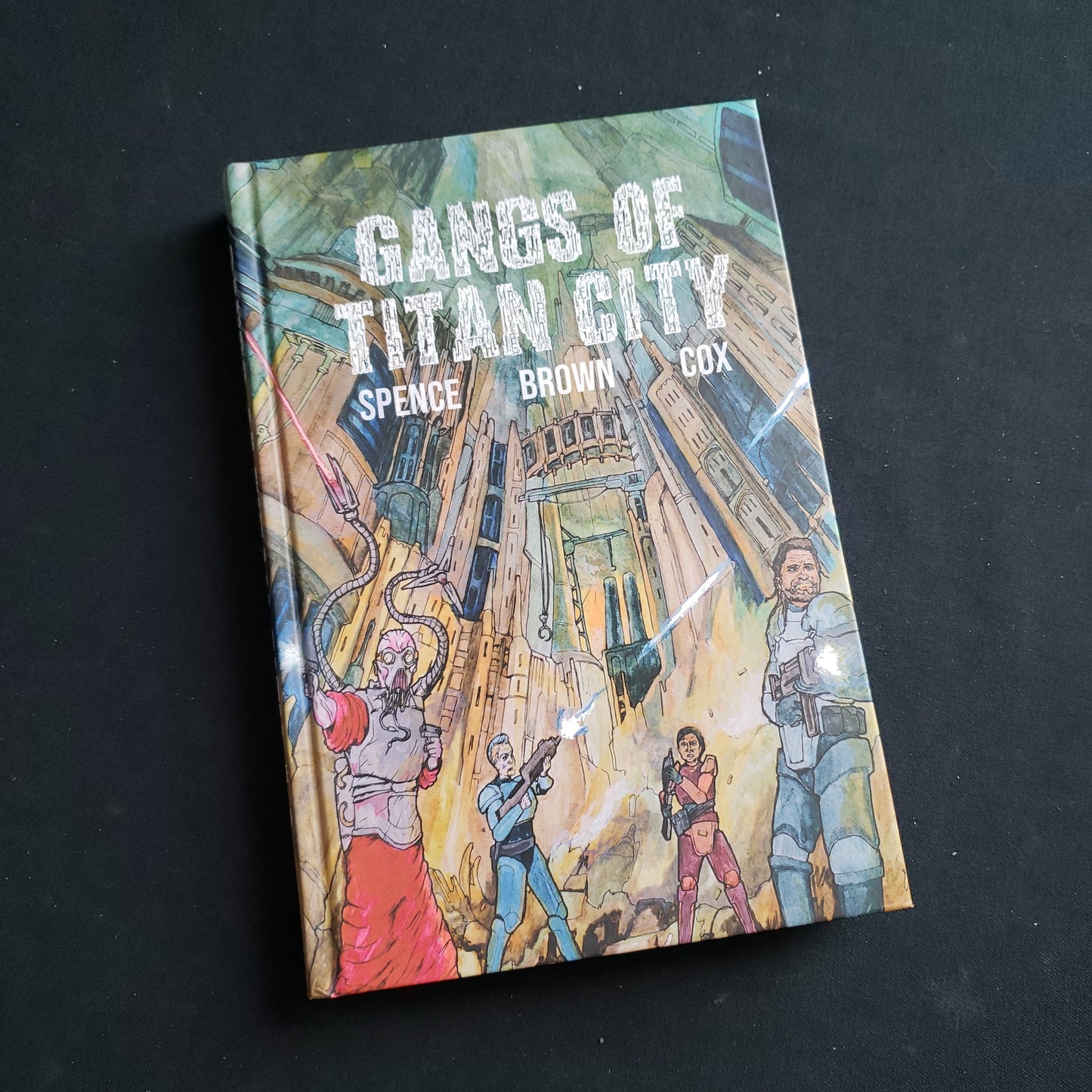 Image shows the front cover of the Gangs of Titan City roleplaying game book