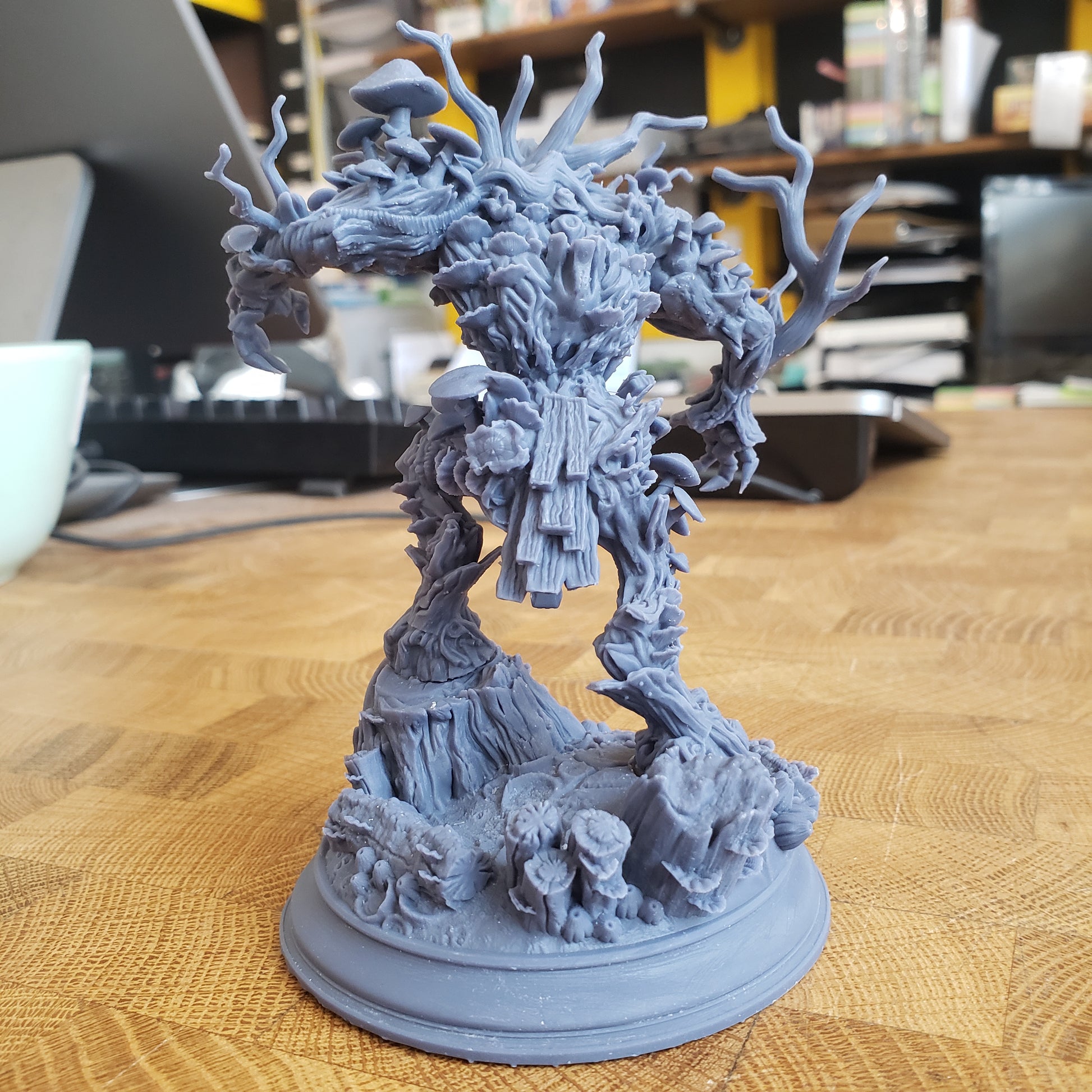 Image is a photo of a 3D printed corrupted treant gaming miniature printed in-house at All Systems Go