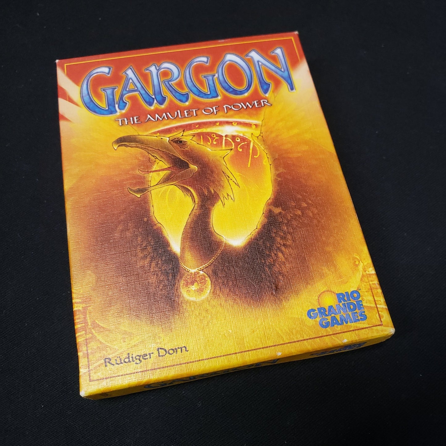 Image shows the front cover of the box of the Gargon card game