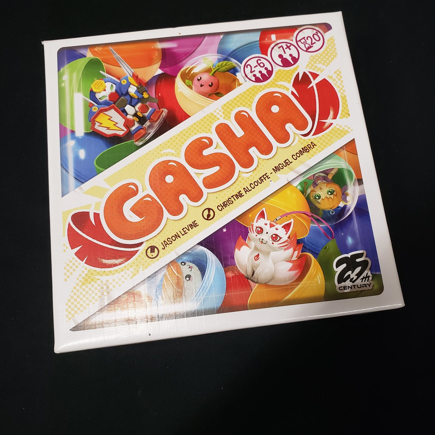 Image shows the front cover of the box of the Gasha card game