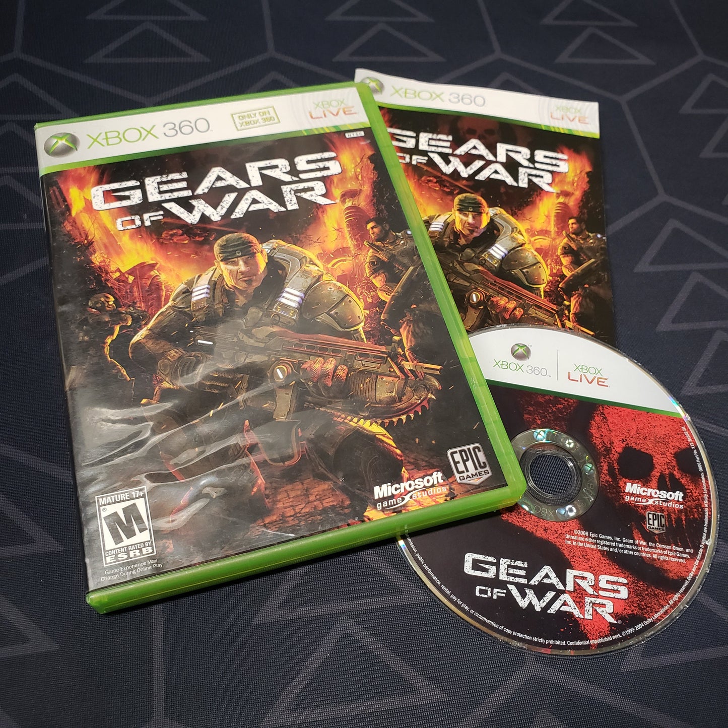 Image shows the case, manual and disc for the video game Gears of War for Xbox 360
