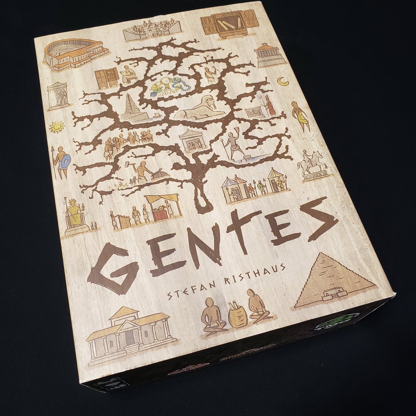Image shows the front cover of the box of the Gentes board game