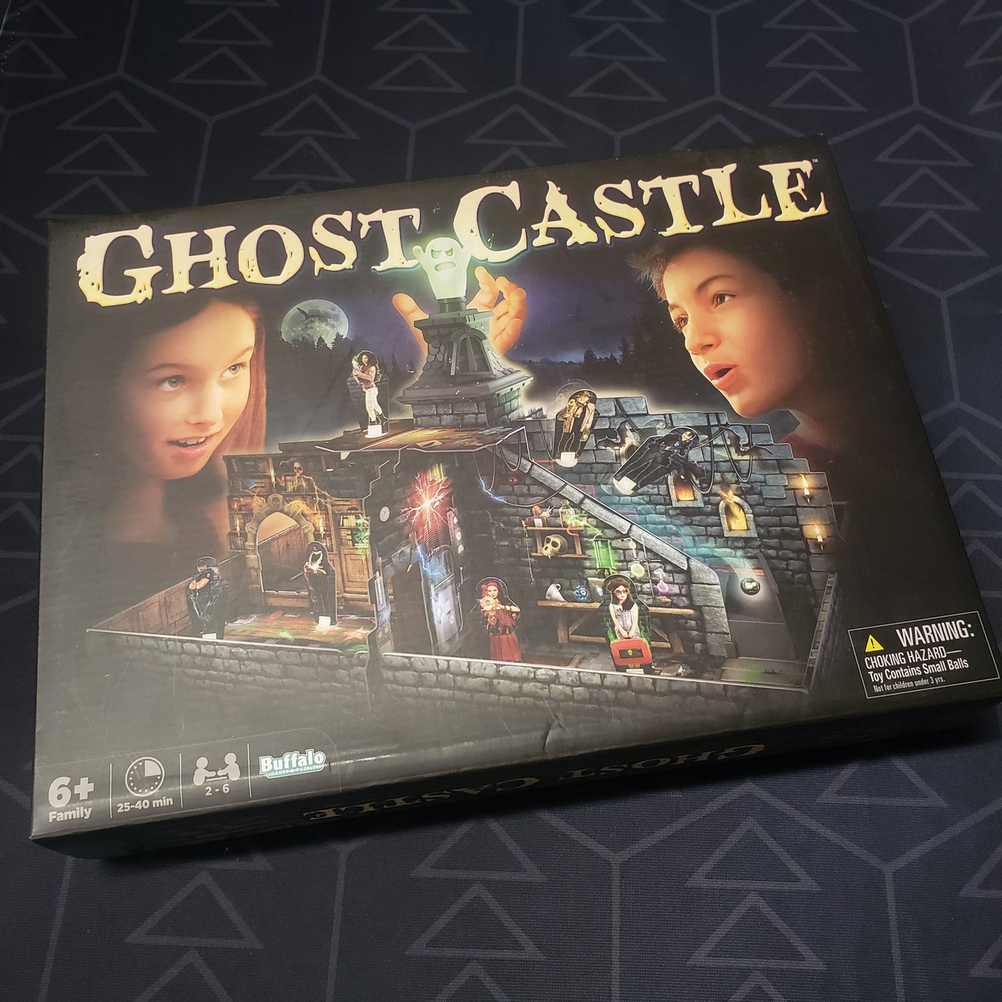 Image shows the front cover of the box for the Ghost Castle board game