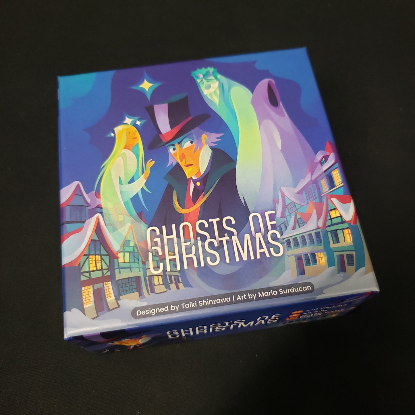 Image shows the front cover of the box of the Ghosts of Christmas coard game
