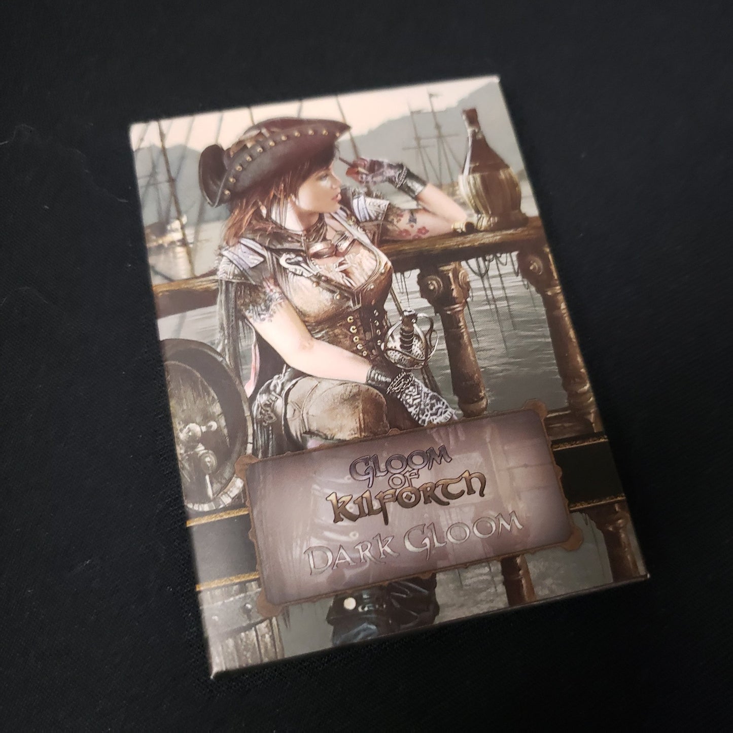 Image shows the front cover of the box of the Dark Gloom pack for the card game Gloom of Kilforth