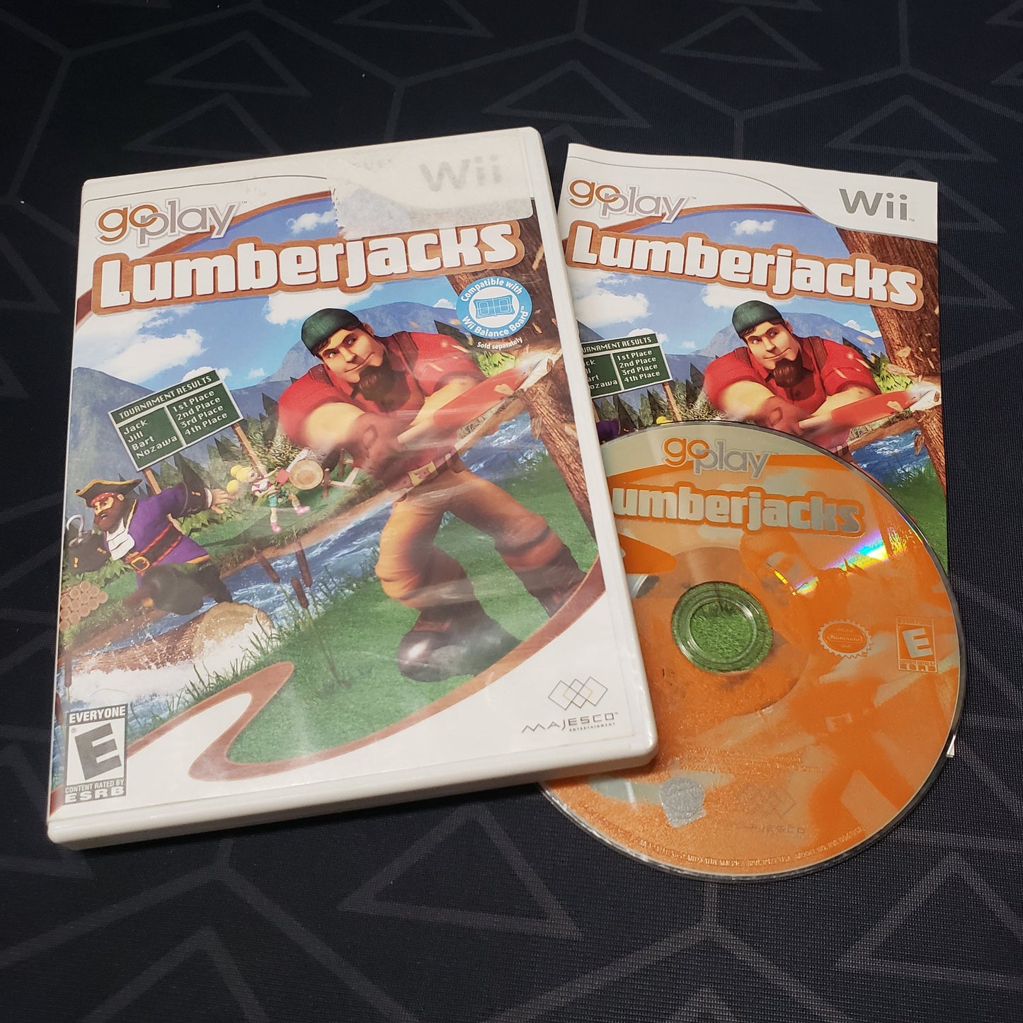 Image shows the case, manual & disc for the video game Go Play Lumberjacks for Nintendo Wii