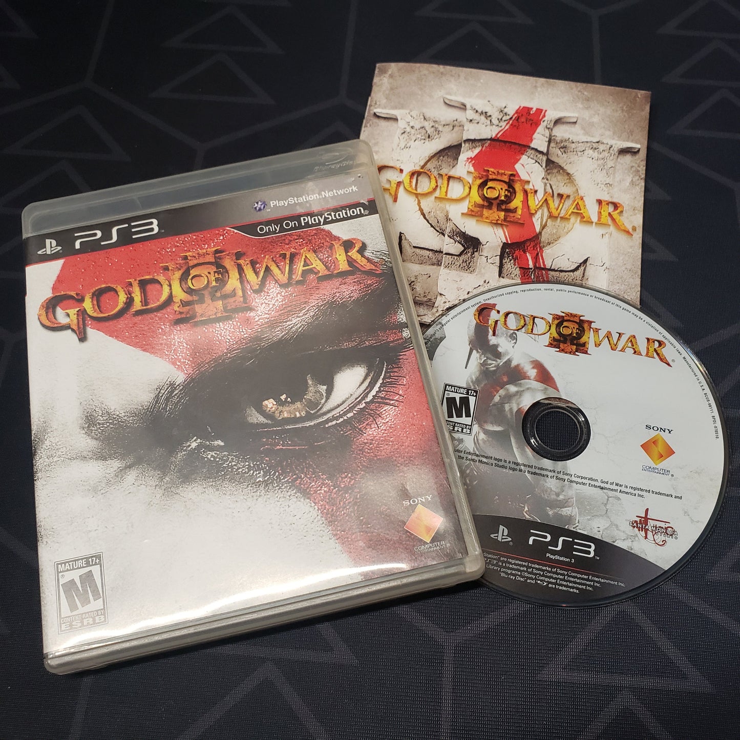 Image shows the case, manual & disc for the video game God of War III for Playstation 3