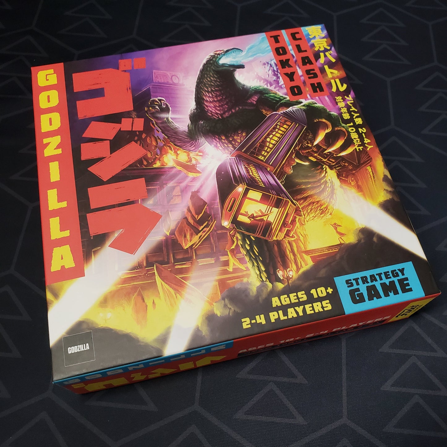 Image shows the front cover of the box of the Godzilla: Tokyo Clash board game