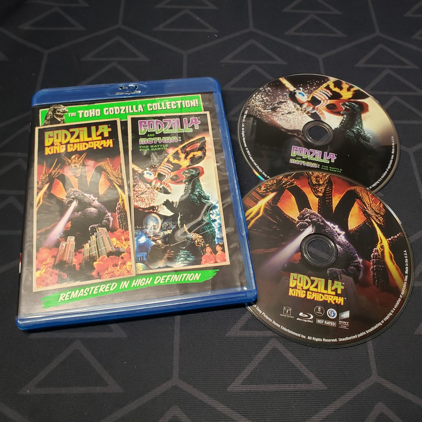 Image shows the case & two discs for the movie set of Godzilla Vs. King Ghidorah & Godzilla Vs. Mothra on Blu-Ray