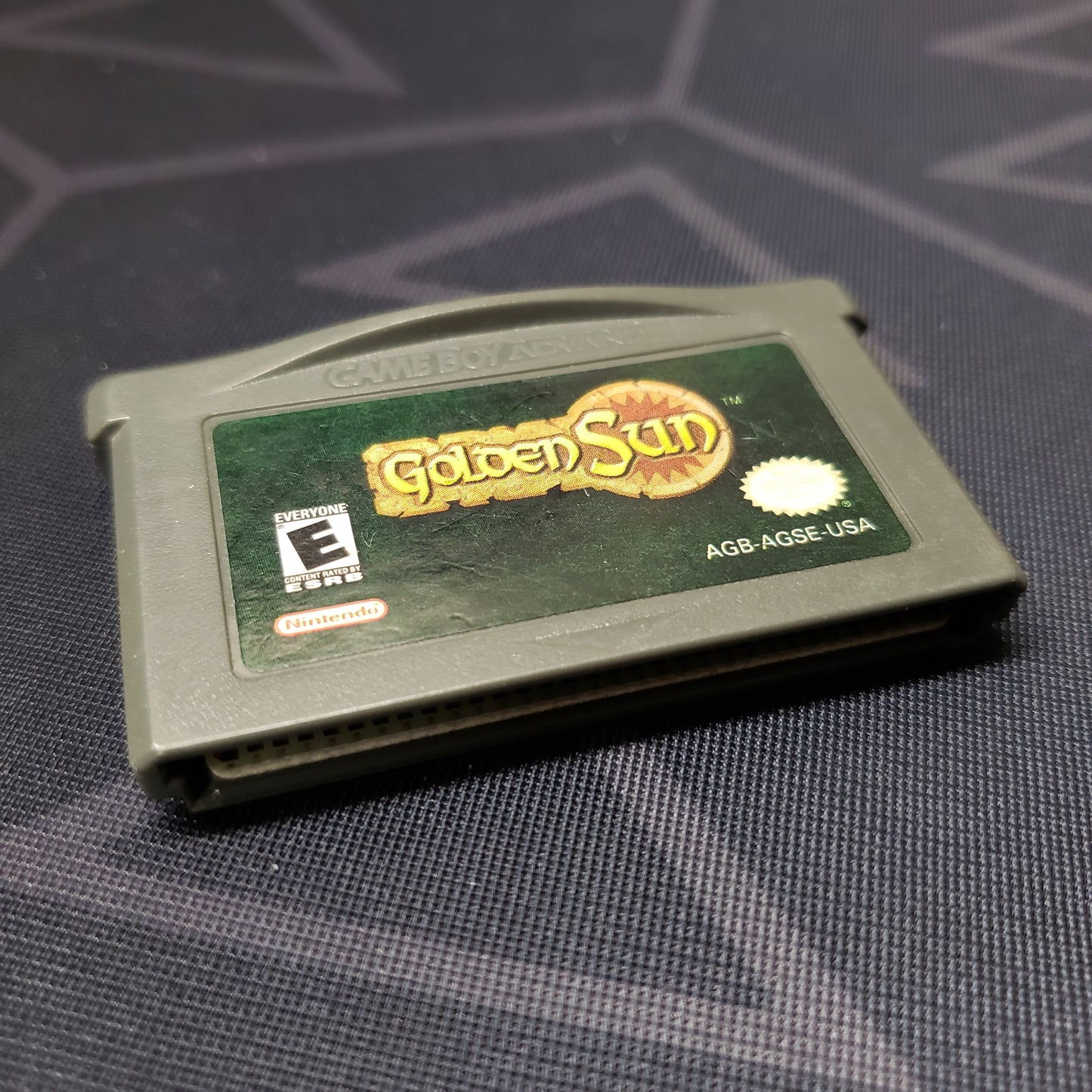 Image shows the front of the cartridge for the video game Golden Sun for Nintendo Game Boy Advance