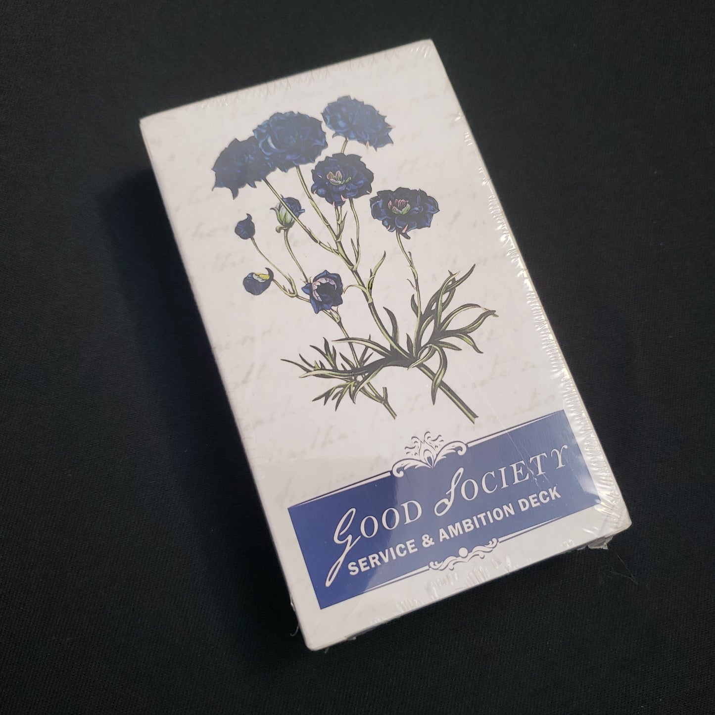 Image shows the front cover of the Service & Ambition Deck for the Good Society roleplaying game