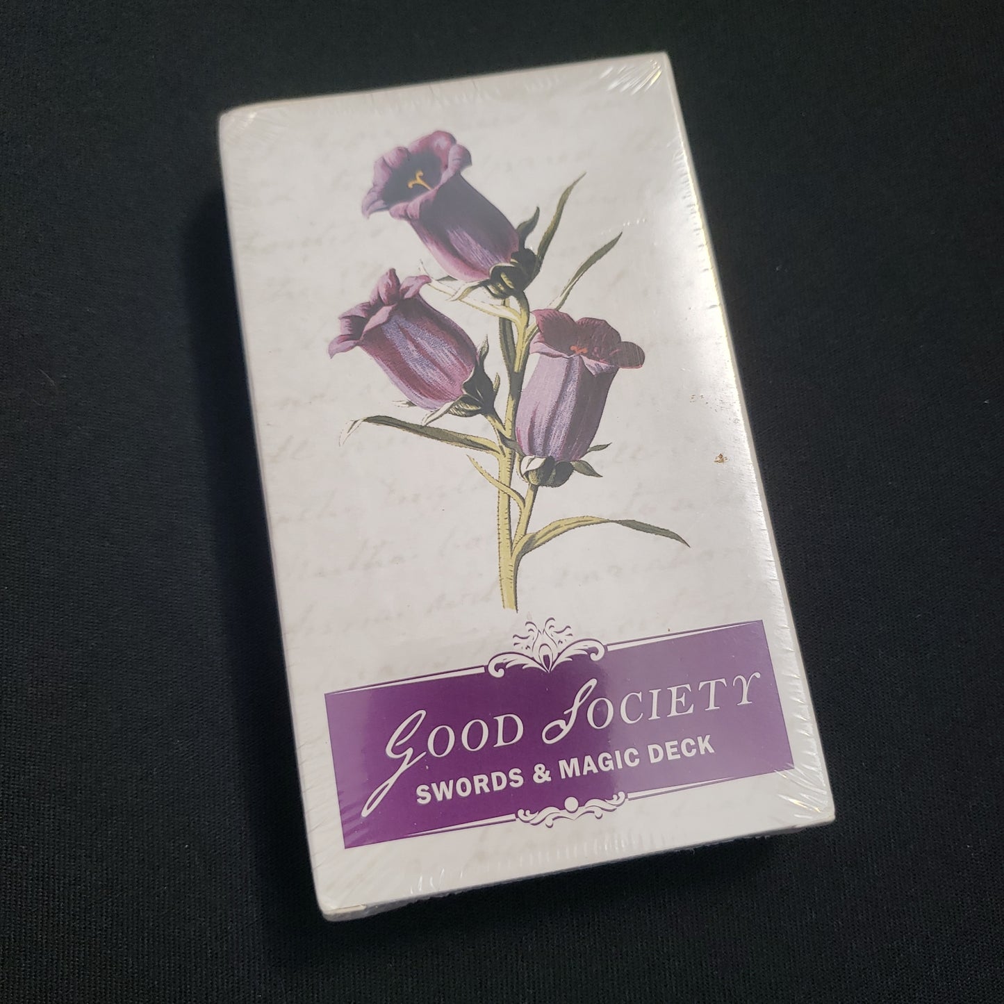 Image shows the front cover of the Swords & Magic Deck for the Good Society roleplaying game